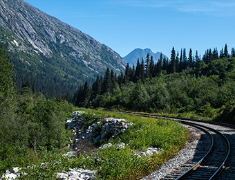 Mountain pass and train in the distance